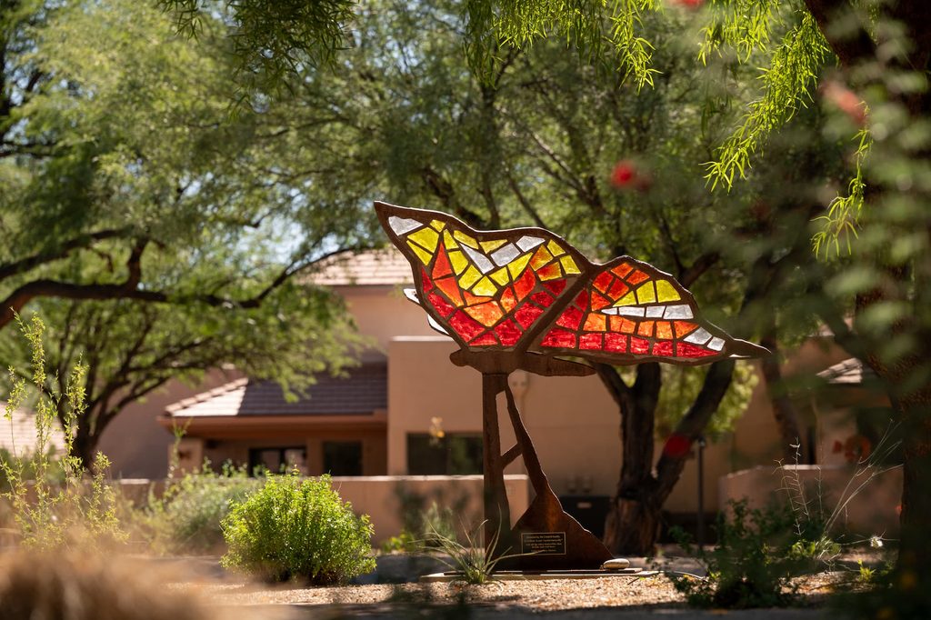 A statue glass art piece of a butterfly found in the courtyard of La Posada Green Valley